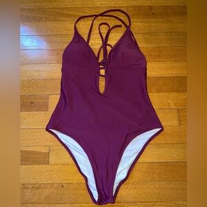 Super flattering one piece never worn